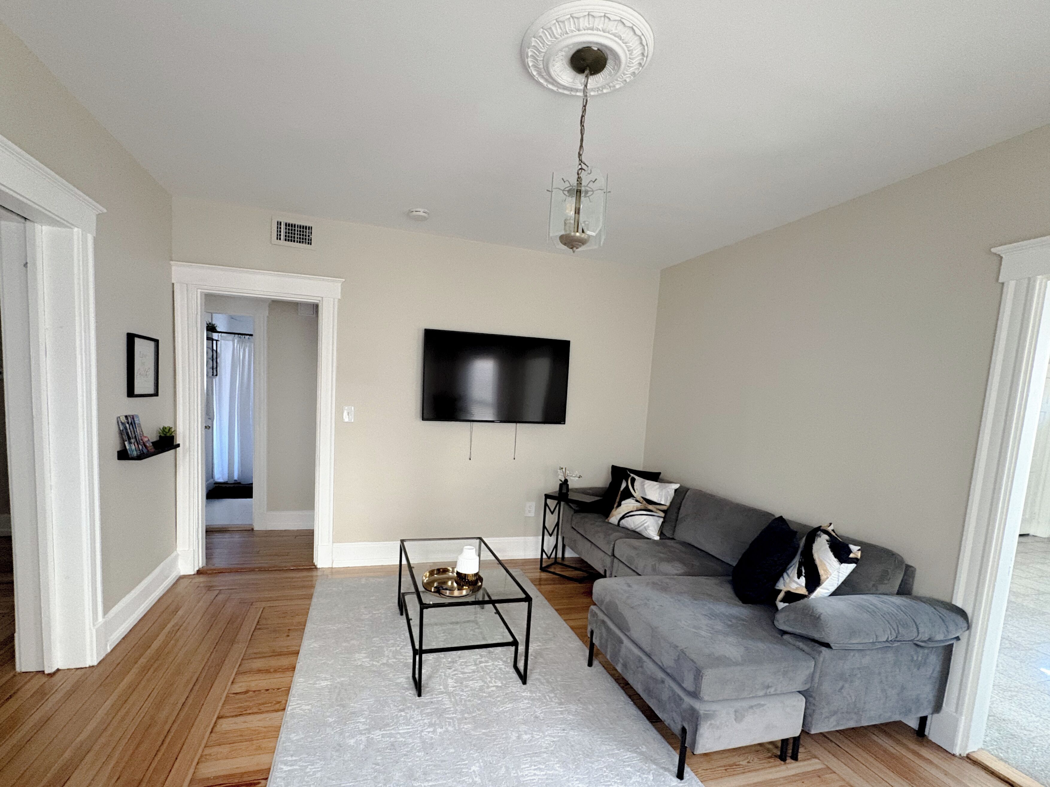 The living room is thoughtfully designed, offering a warm & inviting atmosphere.