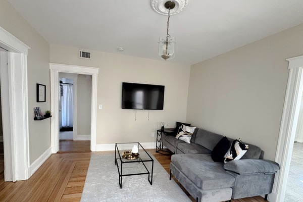 The living room is thoughtfully designed, offering a warm & inviting atmosphere.