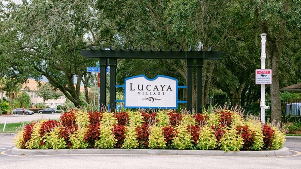 A sign for Lucaya Village with a security notice. - Cozy home Gated community special deals (Kissimmee)