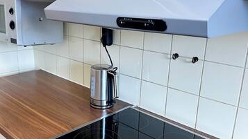 Fridge, microwave, stovetop, cookware/dishes/utensils