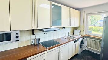 Fridge, microwave, stovetop, cookware/dishes/utensils