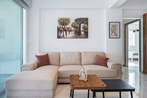 Apartment, 2 Bedrooms, Kitchen, City View | Living room | 55-inch Smart TV with digital channels, streaming services