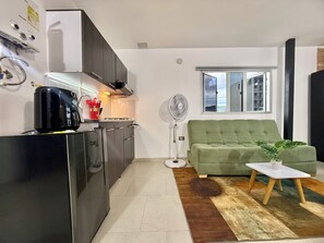 Family Apartment, City View | In-room safe, desk, laptop workspace, blackout drapes