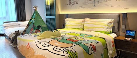 A hotel room with a bed, a nightstand, a digital clock, a wall mural, and a window with curtains.