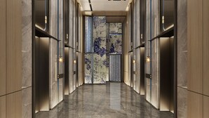 A modern hallway with marble walls and floors, featuring a central decorative panel with a blue pattern. - Crowne Plaza Weihai Binhai (Weihai)