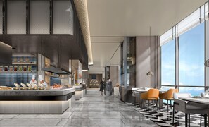 A modern restaurant with a high ceiling, a central bar area, and large windows offering a view of the sky. - Crowne Plaza Weihai Binhai by IHG (Weihai)
