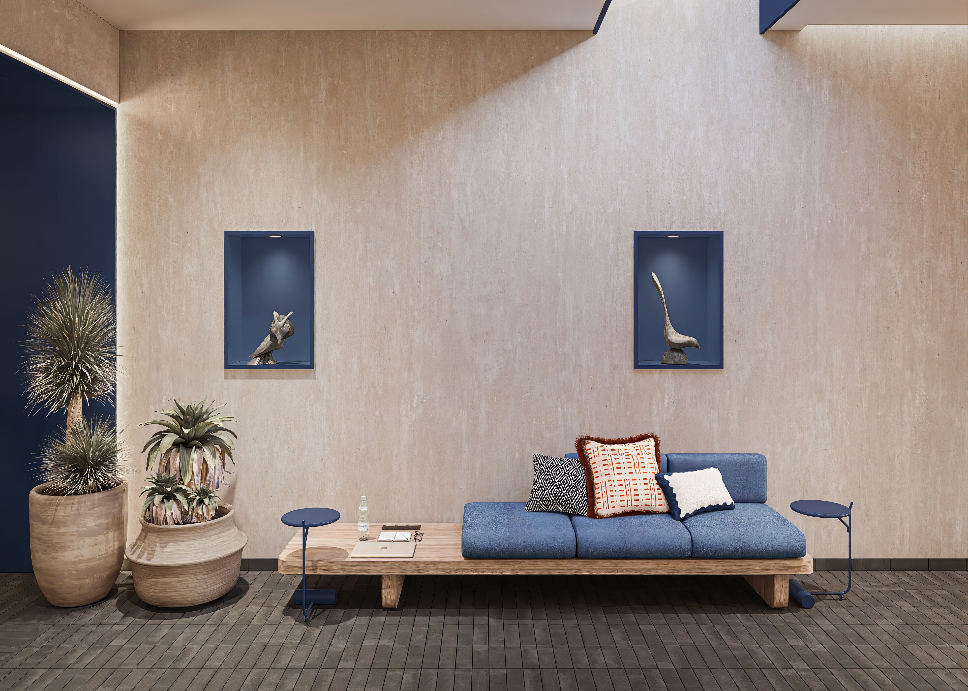 A modern interior with a wooden bench, two wall-mounted displays, and potted plants.