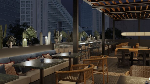An outdoor seating area with tables and chairs, a wooden pergola, and a view of tall buildings in the background.