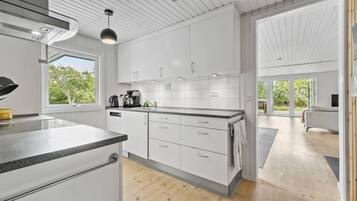 Fridge, stovetop, dishwasher, coffee/tea maker