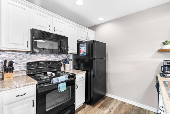 Condo, Multiple Beds, Balcony (Sunsational Views at Anchors Point) | Private kitchen | Fridge, microwave, oven, stovetop