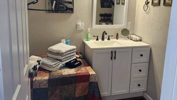 Shower, hair dryer, towels