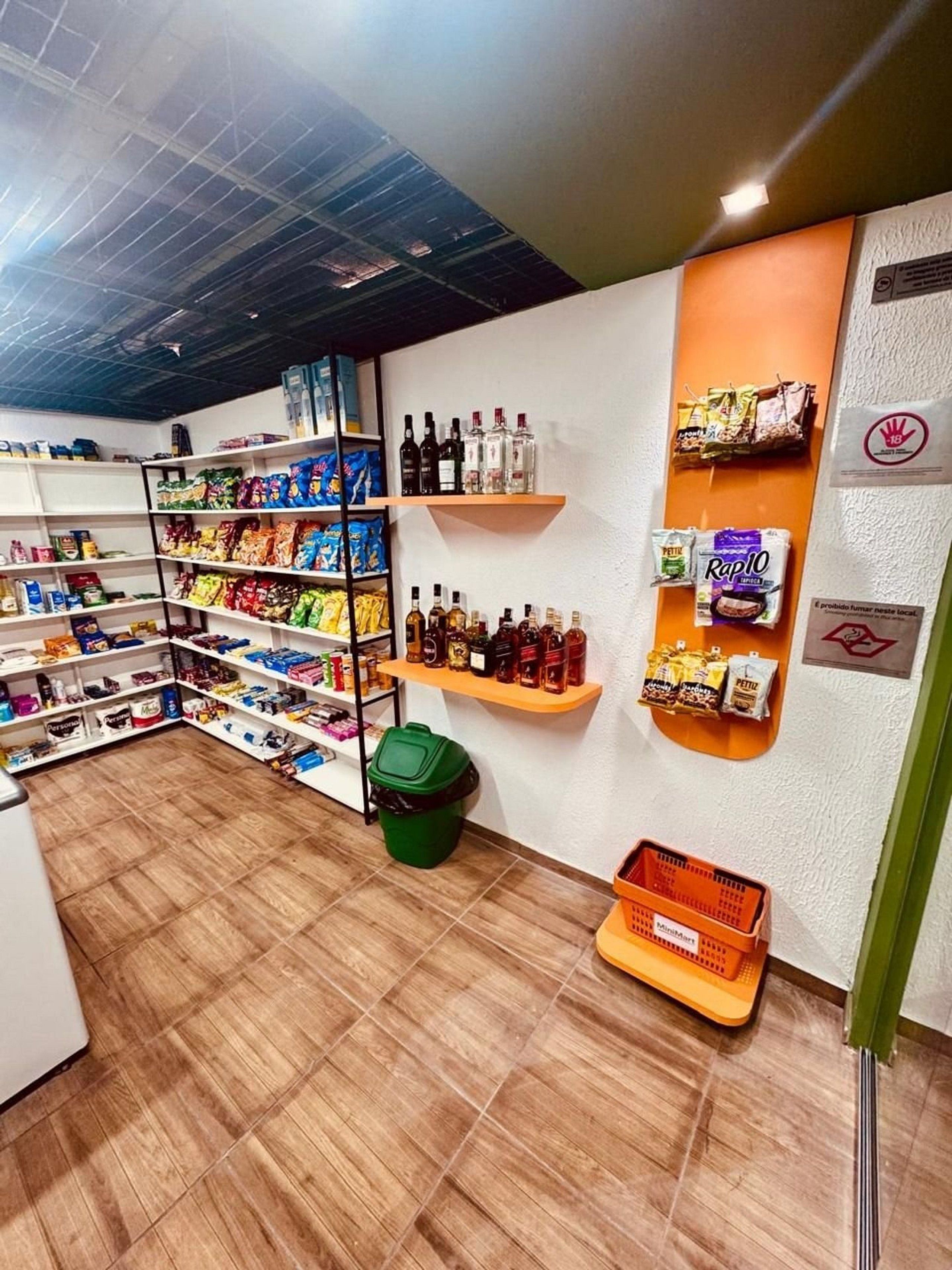 A retail space with shelves stocked with snacks, beverages, and packaged goods.
