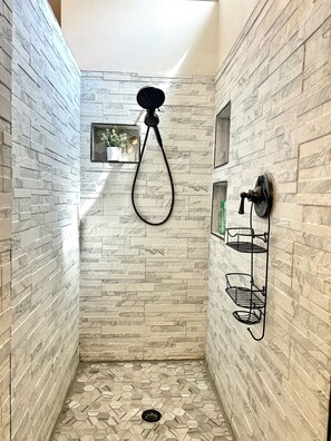 Shower, hair dryer, towels, soap