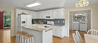 Lake front with dock home in charming Fair Play with AC, fitness room