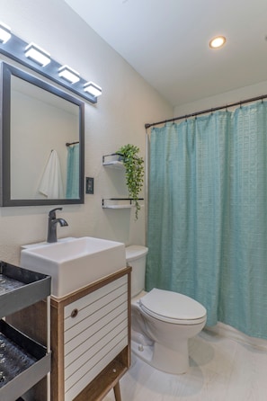 Hair dryer, towels, soap, shampoo