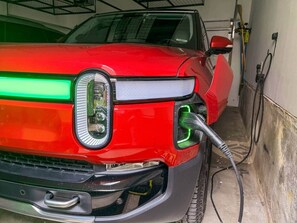 Two-car garage with automatic door and remote access for secure parking. Guests can also enjoy complimentary use of the Level 2 electric vehicle charger, making it convenient for EV owners during their stay.