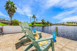 Terrace/patio - Riverfront Luxury with Heated Pool, Spa & Private Dock – Sunny Shores Escape (Cape Coral)