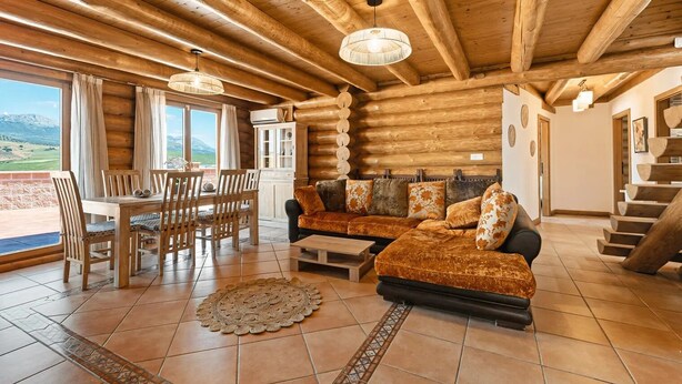 A log cabin interior with a dining area, sofa, and staircase. - Nordic cottage on the Costa del Sol, enjoy the Andalusian climate with swimming pool! (AN)