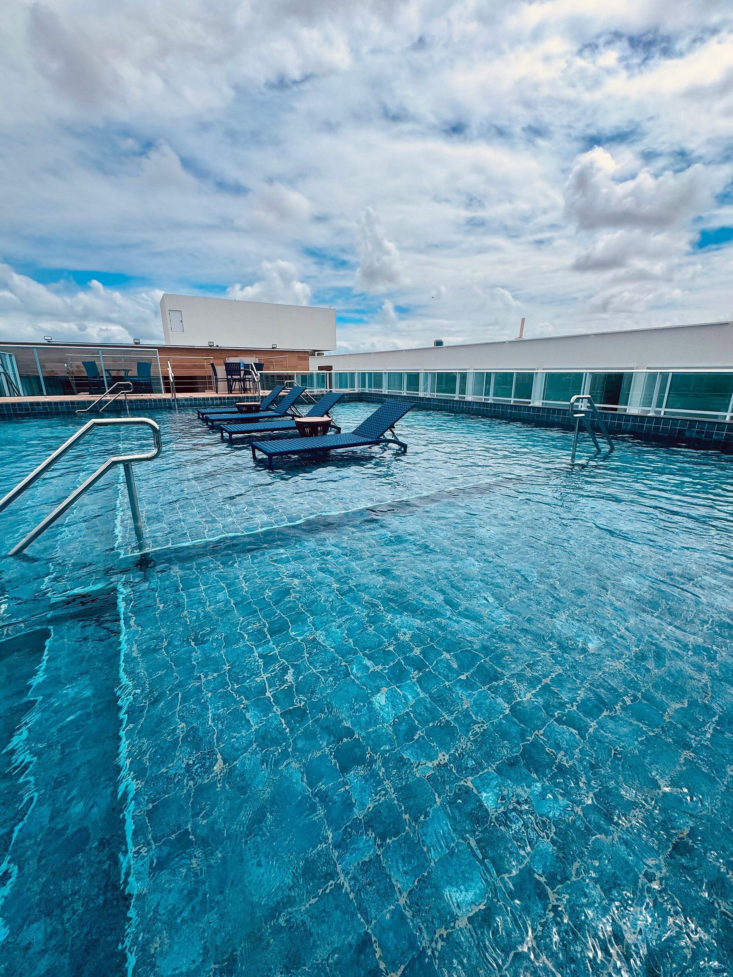 Outdoor pool, open 8:00 AM to 10:00 PM, pool loungers
