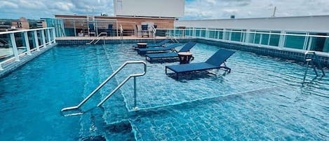 Outdoor pool, open 8:00 AM to 10:00 PM, sun loungers