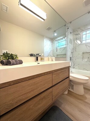 Shower, hair dryer, towels, soap