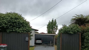 A residential driveway leading to a garage under a bridge. - 1 Double and 1 single Bed unit B (Rotorua)