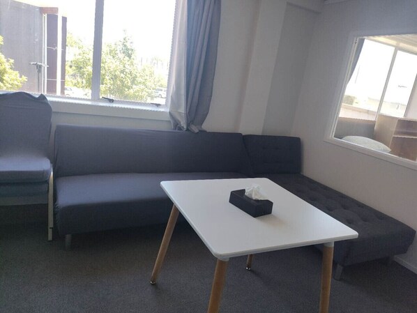 Living area - 6 Beds including 1 DBL Bed, 1 Single Bed, 4 Singgle Sofa Bed in 1 Room & 1 Lounge (Auckland)