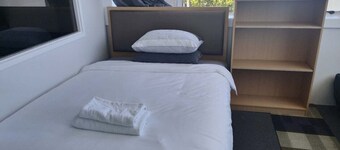 6 Beds including 1 DBL Bed, 1 Single Bed, 4 Singgle Sofa Bed in 1 Room & 1 Lounge