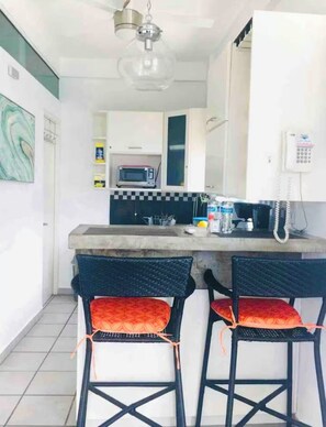 Fridge, microwave, stovetop, coffee/tea maker