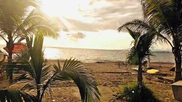 On the beach, sun loungers, beach towels