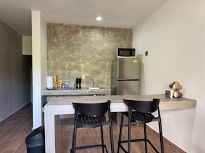 Fridge, microwave, stovetop, coffee/tea maker