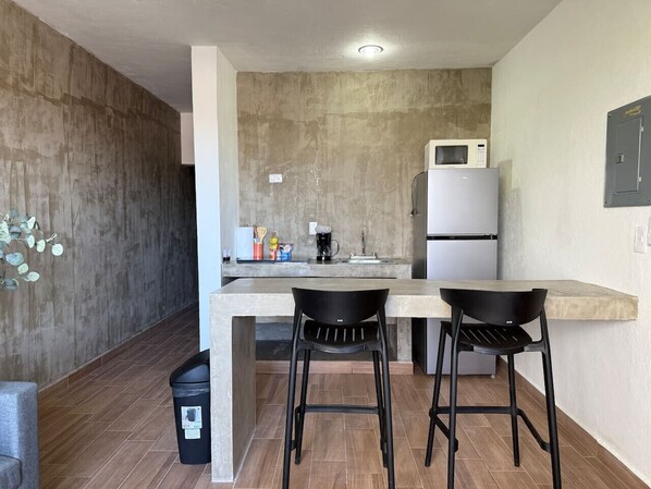 Fridge, microwave, stovetop, coffee/tea maker