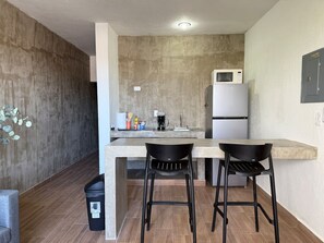 Fridge, microwave, stovetop, coffee/tea maker