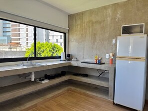 Fridge, microwave, stovetop, coffee/tea maker