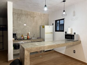 Fridge, microwave, stovetop, coffee/tea maker