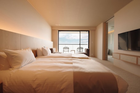 Junior Suite, Ocean View | Minibar, in-room safe, desk, laptop workspace