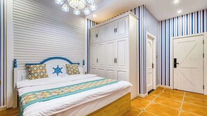 A bedroom with a bed, a wardrobe, and a door.