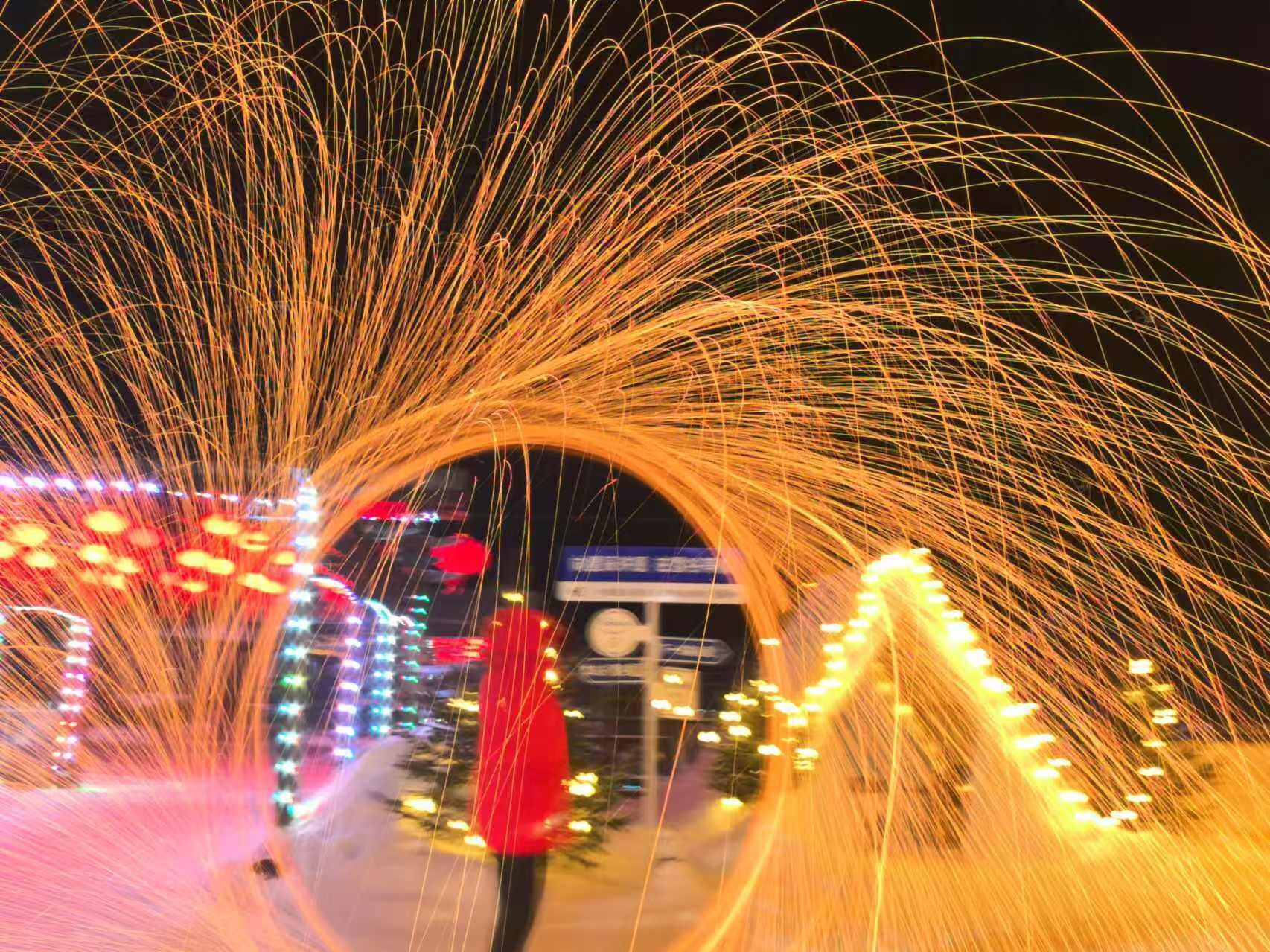 A tunnel with light trails and colorful lights.