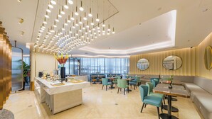 A modern dining area with a central island, multiple seating options, and a ceiling with numerous hanging lights. - Shanghai Lujiazui BaBaiBan LANOU Hotel (Shanghai)