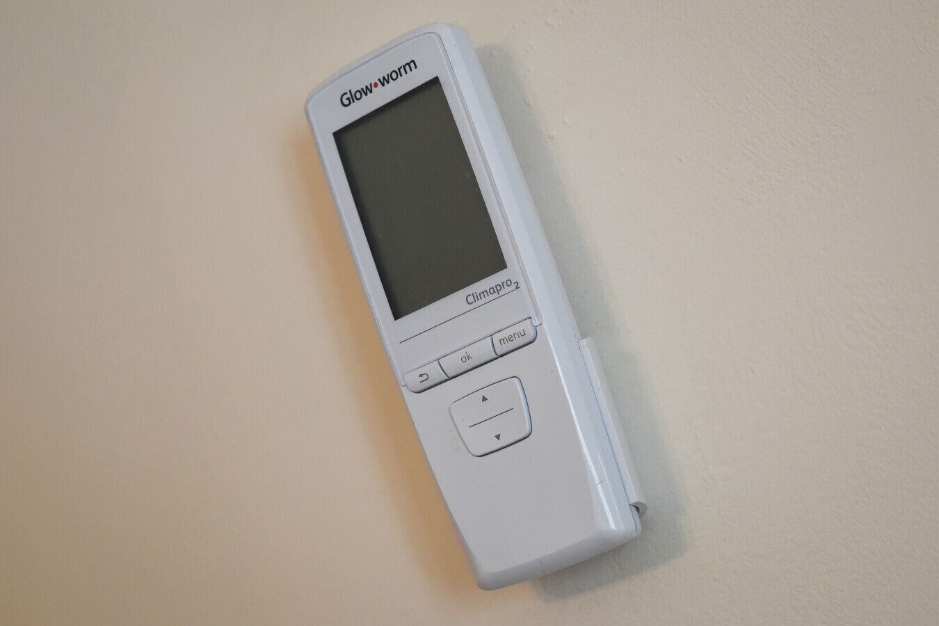 Een witte Climagro 2 met een scherm en bedieningsknoppen.