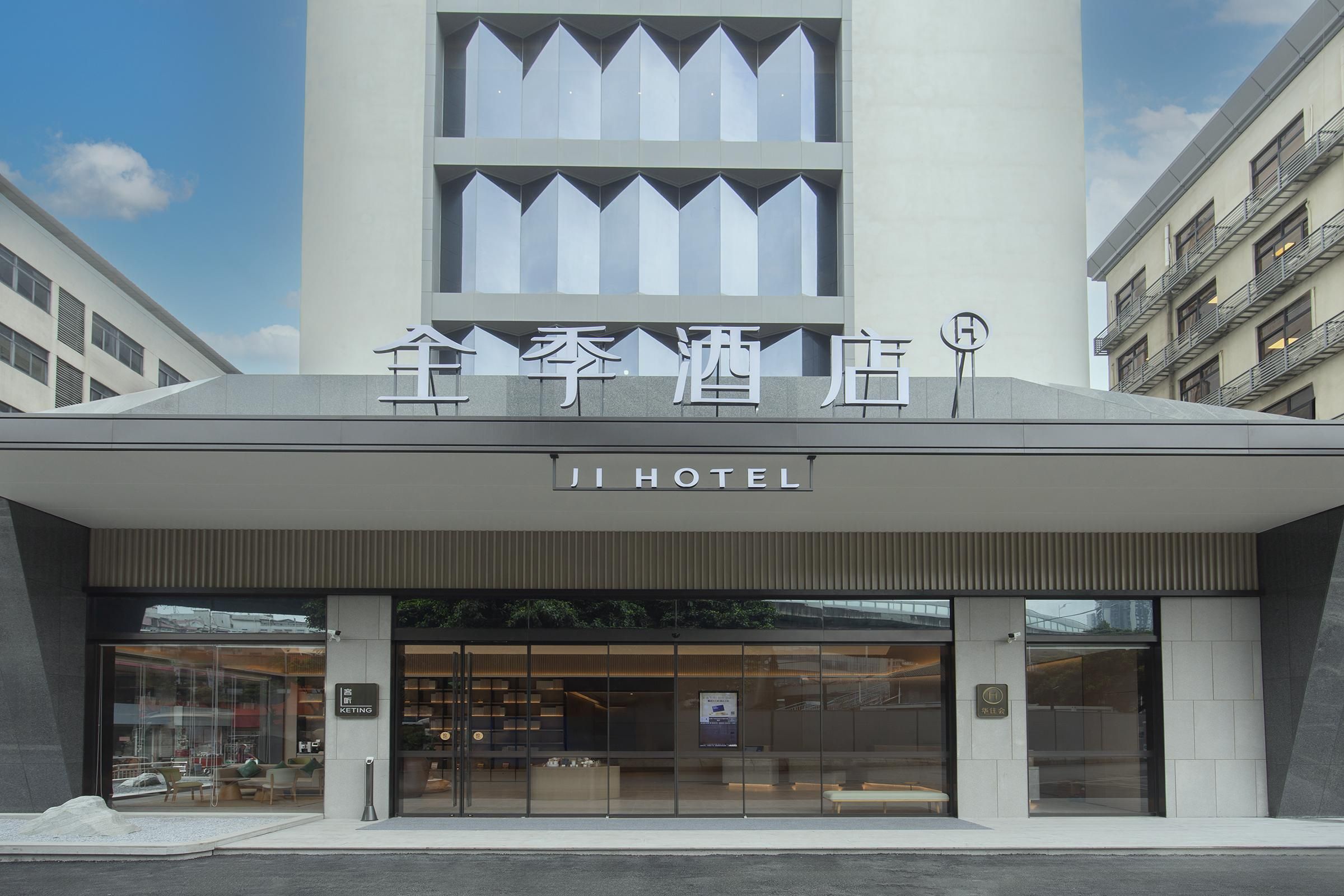The exterior of Ji Hotel with a modern design, large glass windows, and a sign indicating a KETTING restaurant inside.