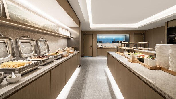 A modern buffet setup with various food items and utensils. - Ji Guangzhou Liwan TCL Yunfeng Technology Park (Guangzhou)