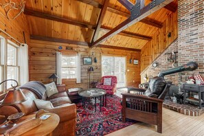 TV, books - Charming riverfront home with cozy interiors, dock, and scenic deck views (Westport Island)