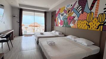 Beach Front Quadruple | Desk, bed sheets