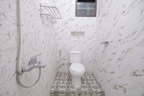 Habitación Deluxe | Baño | Regadera y toallas