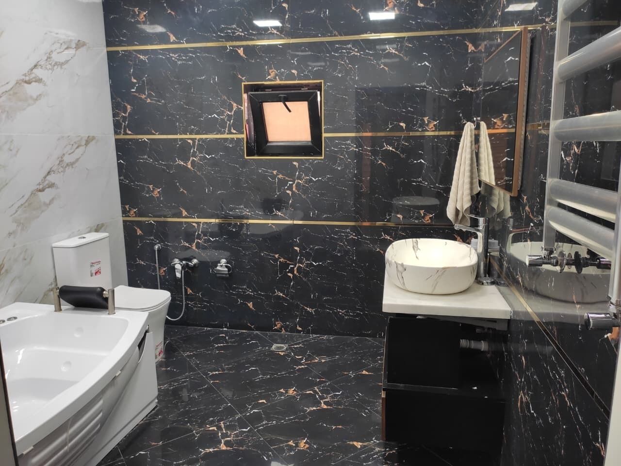 Jetted tub, hair dryer, towels, toilet paper