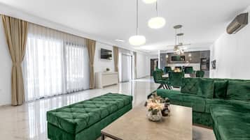 Villa (Villa With Private Pool) | Living room | 32-inch flat-screen TV with satellite channels