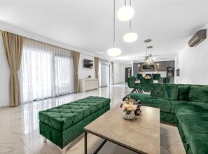 Villa (Villa With Private Pool) | Living room | 32-inch flat-screen TV with satellite channels