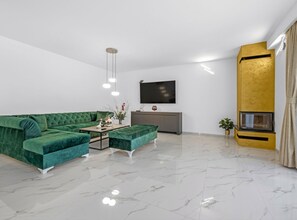 Villa (Villa With Private Pool) | Living room | 32-inch flat-screen TV with satellite channels