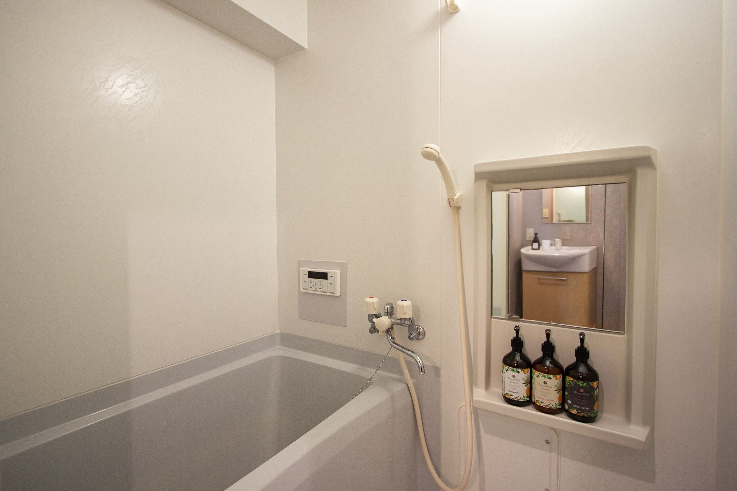 Combined shower/bathtub, hair dryer, bathrobes, slippers
